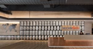 Keg wall and copper reception desk in the lobby of Molson Coors' Denver headquarters