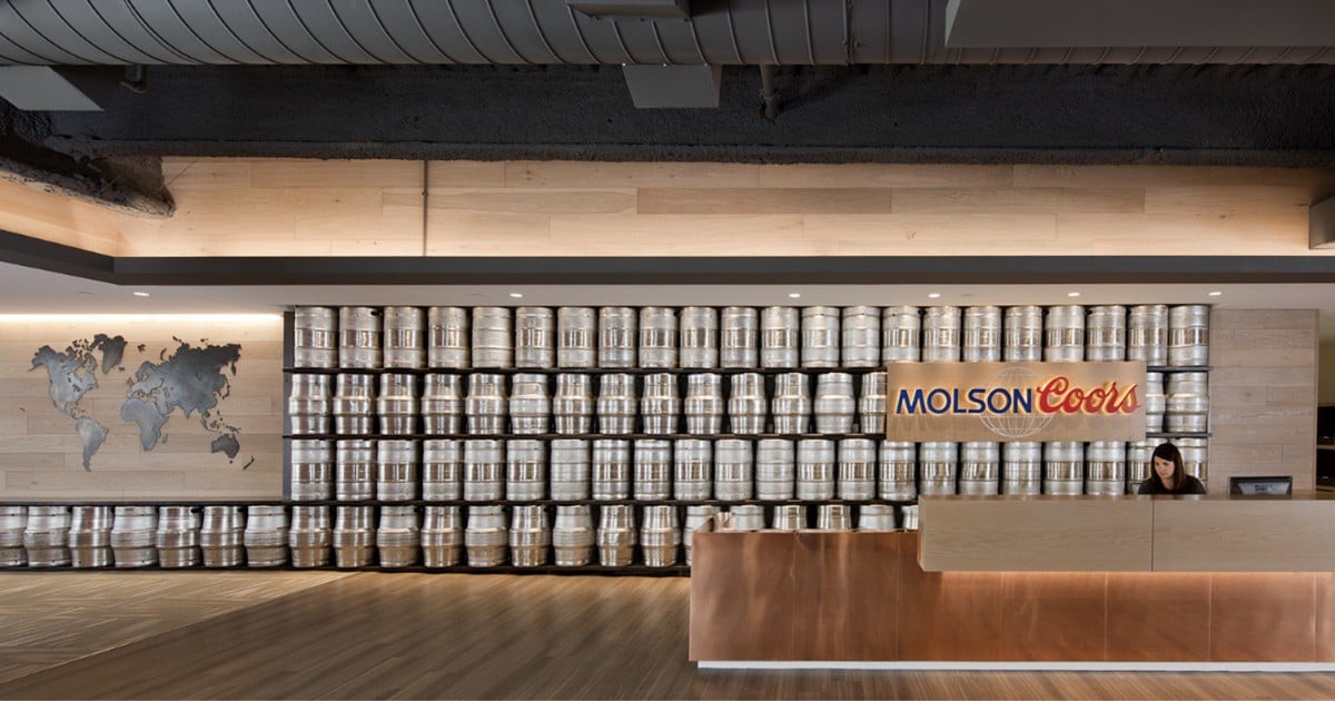 Keg wall and copper reception desk in the lobby of Molson Coors' Denver headquarters